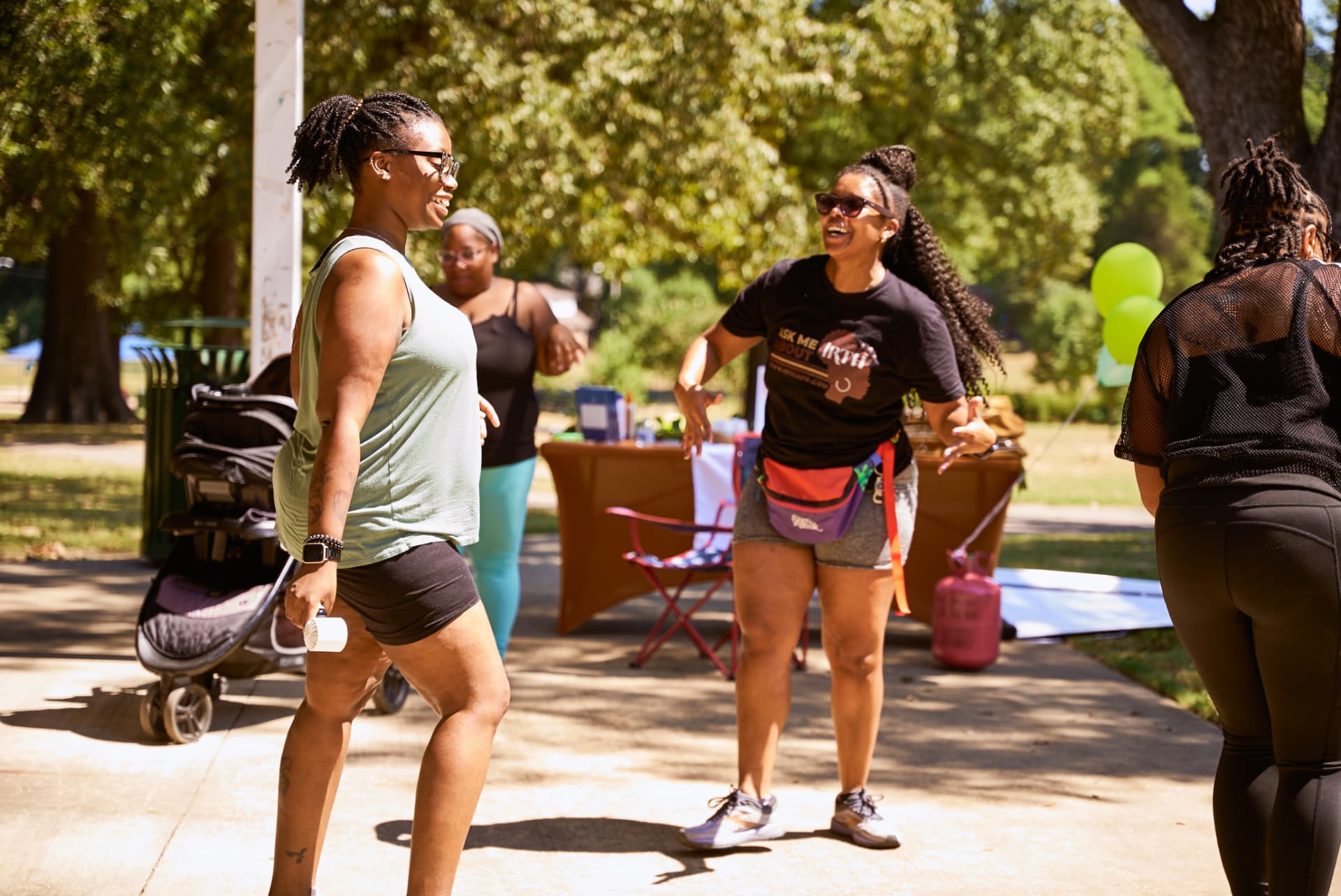 Ambassadors laughing and dancing in the park